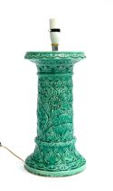 Interior design interest: a large green glazed ceramic column table lamp with sunflower and
