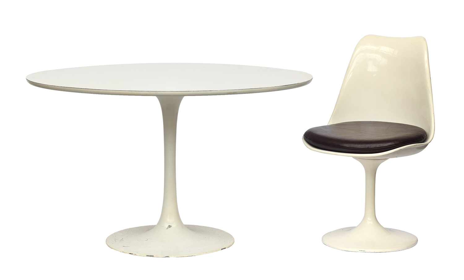 A white Knoll Eero Saarinen 'Tulip' style circular dining table with white formica top, 121cm