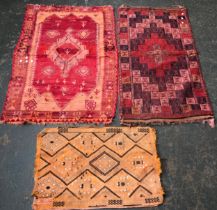 A small kilim rug, together with two others, 138x93cm; 140x75cm; 59x87cm