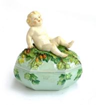 A rare early 20th century Royal Worcester porcelain box, modelled by Henri Bargas, the lid