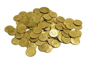 A large quantity of spade guinea gaming tokens