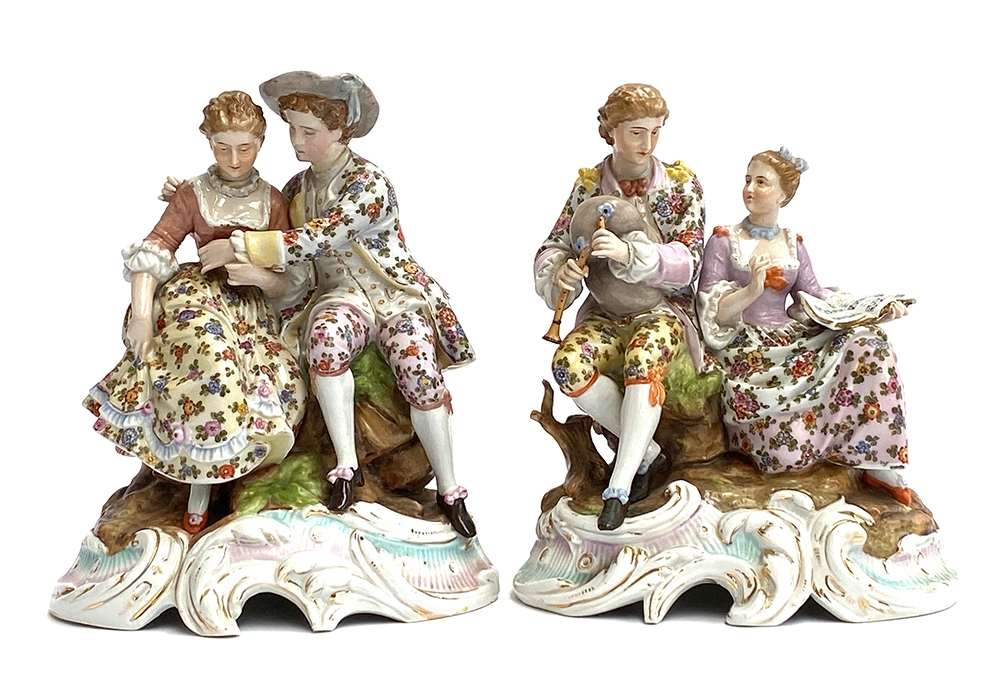 A pair of early 20th century pseudo Meissen porcelain figures of courting couples in continental