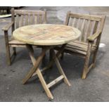 A pair of teak garden armchairs, approx 66.5cmH; together with a folding circular table, 75cmH 80cmD