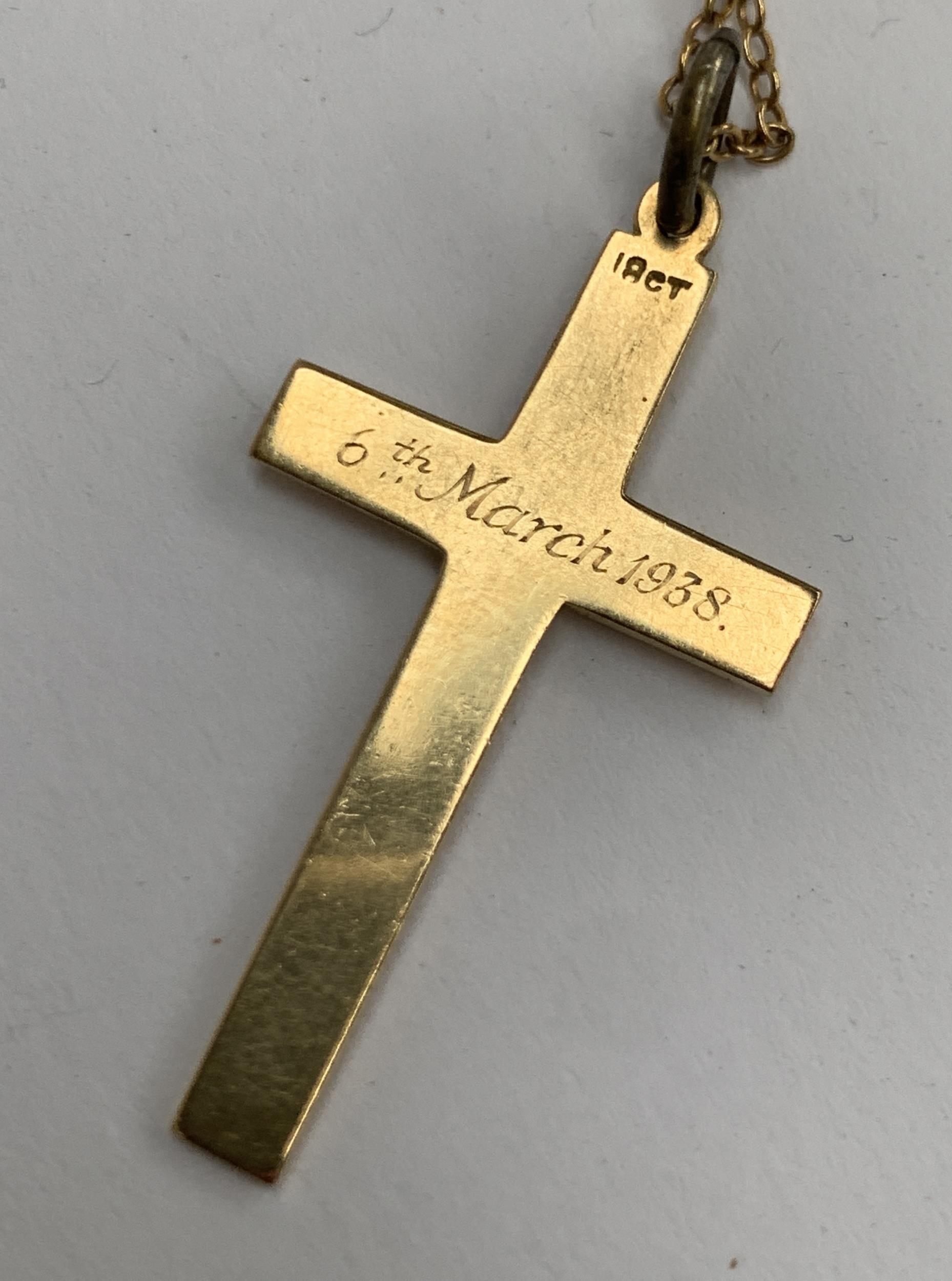 A 9ct gold chain, 1.6g; together with an 18ct gold crucifix, engraved '6th March 1938', 3.4cmL, 2.7g - Image 2 of 2