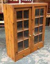 A glazed pine cabinet with two doors and shelves, 100cmW