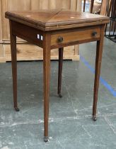 An Edwardian mahogany and line inlaid envelope card table, on square tapered legs, 51x51x78cmH