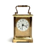A gilt metal carriage clock, the dial signed Taylor & Bligh, 11cmH