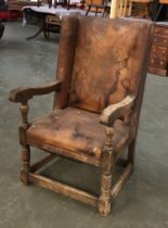An oak and leather upholstered armchair in 17th century style, 64cmW