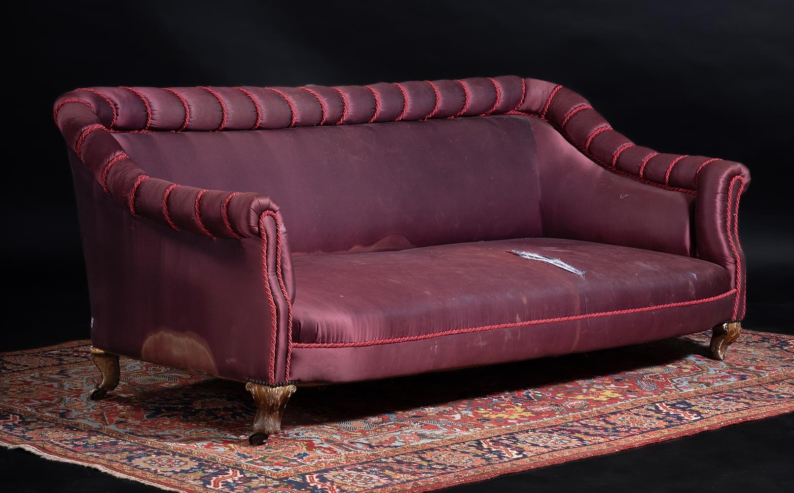 An early Victorian giltwood and upholstered sofa, c.1840, by Hampton & Sons, Pall Mall, with stamped
