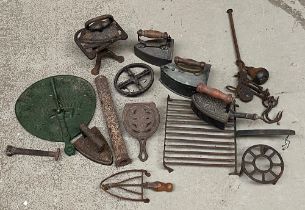 Various ironmongery, to include meat hooks, box irons, 'The Monarch' two horse corn drill; trivets