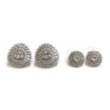 A pair of good quality 925 silver and CZ stud earrings, a central trillion cut CZ surrounded by