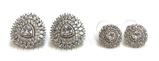 A pair of good quality 925 silver and CZ stud earrings, a central trillion cut CZ surrounded by