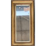 A rectangular gilt framed mirror, with bevelled glass, 103x52cm