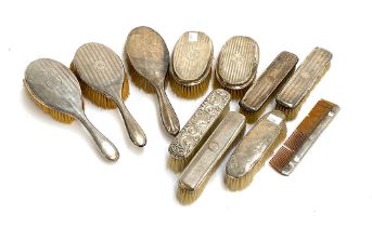 A mixed lot of early 20th century silver backed clothes and hair brushes, with a comb (11)