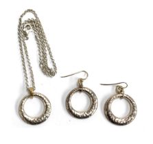 A 925 silver hammered effect pendant on chain; together with matching earrings