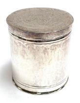 An Eastern white metal lidded canister, the lid engraved with script and stamped 'M', 8cmH,