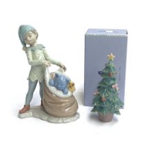 A Lladro figurine no. 6894 'Santas sack of Dreams'; together with a boxed Lladro Christmas Tree