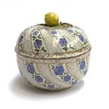 A Meissen style porcelain lidded pot, the exterior painted with gilt and convolvulus, the interior