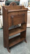 An Arts and Crafts oak student bureau, pigeon holed compartment over two shelves, 70x26x118cmH