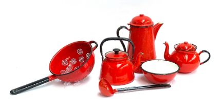 A quantity of vintage red enamel kitchenware, some Polish, to include colander, teapot, coffee