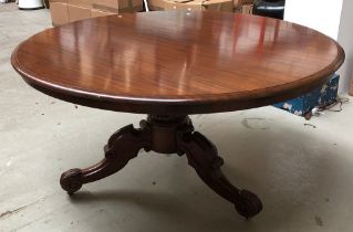 A circular mahogany tip-top breakfast table, on carved tripod base, approx. 133cmD, 72cmH