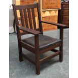 An Arts and Crafts Gustav Stickley style oak open armchair, 70cmW