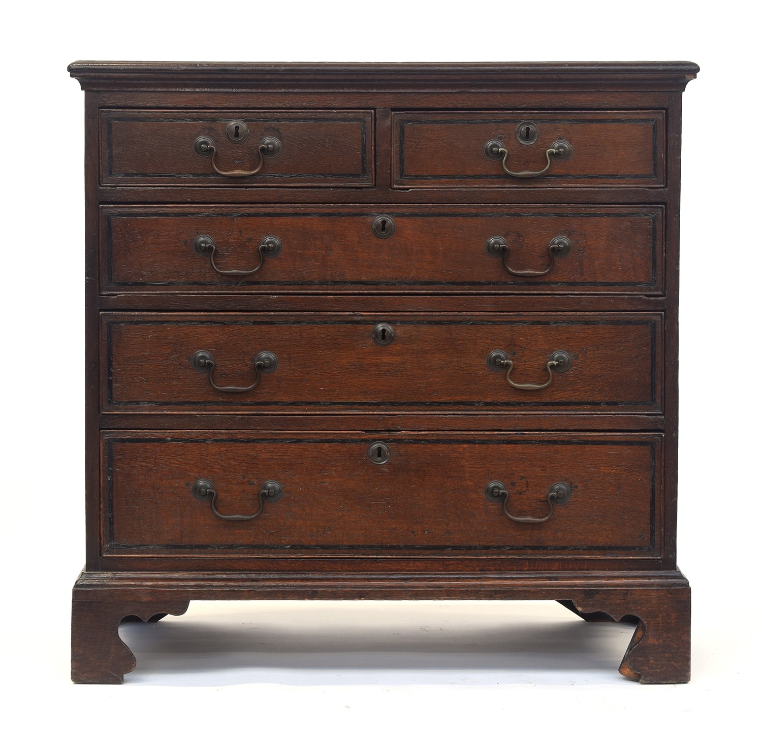 An 18th century oak chest, the moulded top above two short and three graduating drawers, on