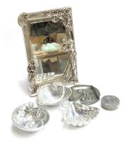 A plated Art Nouveau style mirror, 40cmH; together with three seashell dishes; and two pewter items