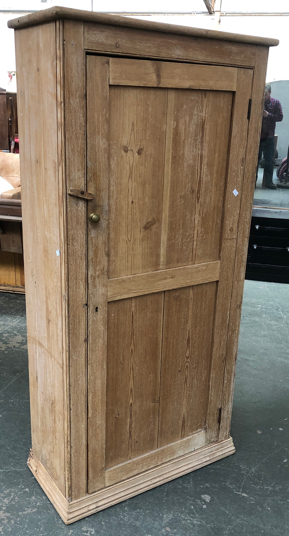 A shallow pine cupboard, with single panelled door, opening to five shelves, 80x37x164cmH