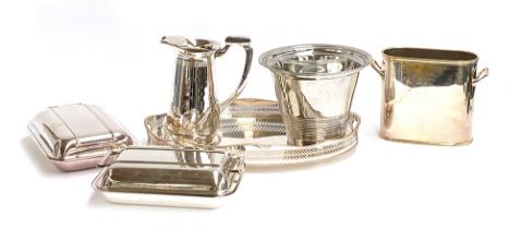 A quantity of silver plated items to include a heavy pitcher; champagne bucket; galleried tray;