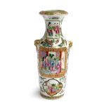 A late 19th century Chinese famille rose vase of baluster form with applied lion mask handles,