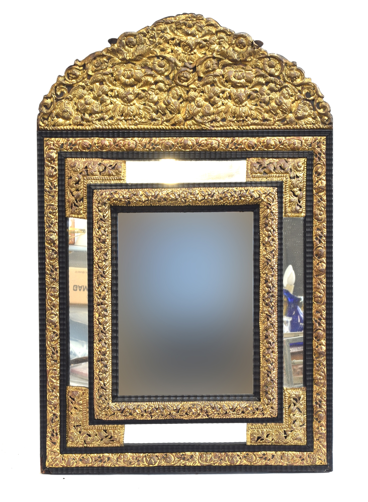 A 19th century French worked metal and ebonised wall mirror, c.1900, in baroque style, the central
