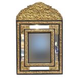 A 19th century French worked metal and ebonised wall mirror, c.1900, in baroque style, the central