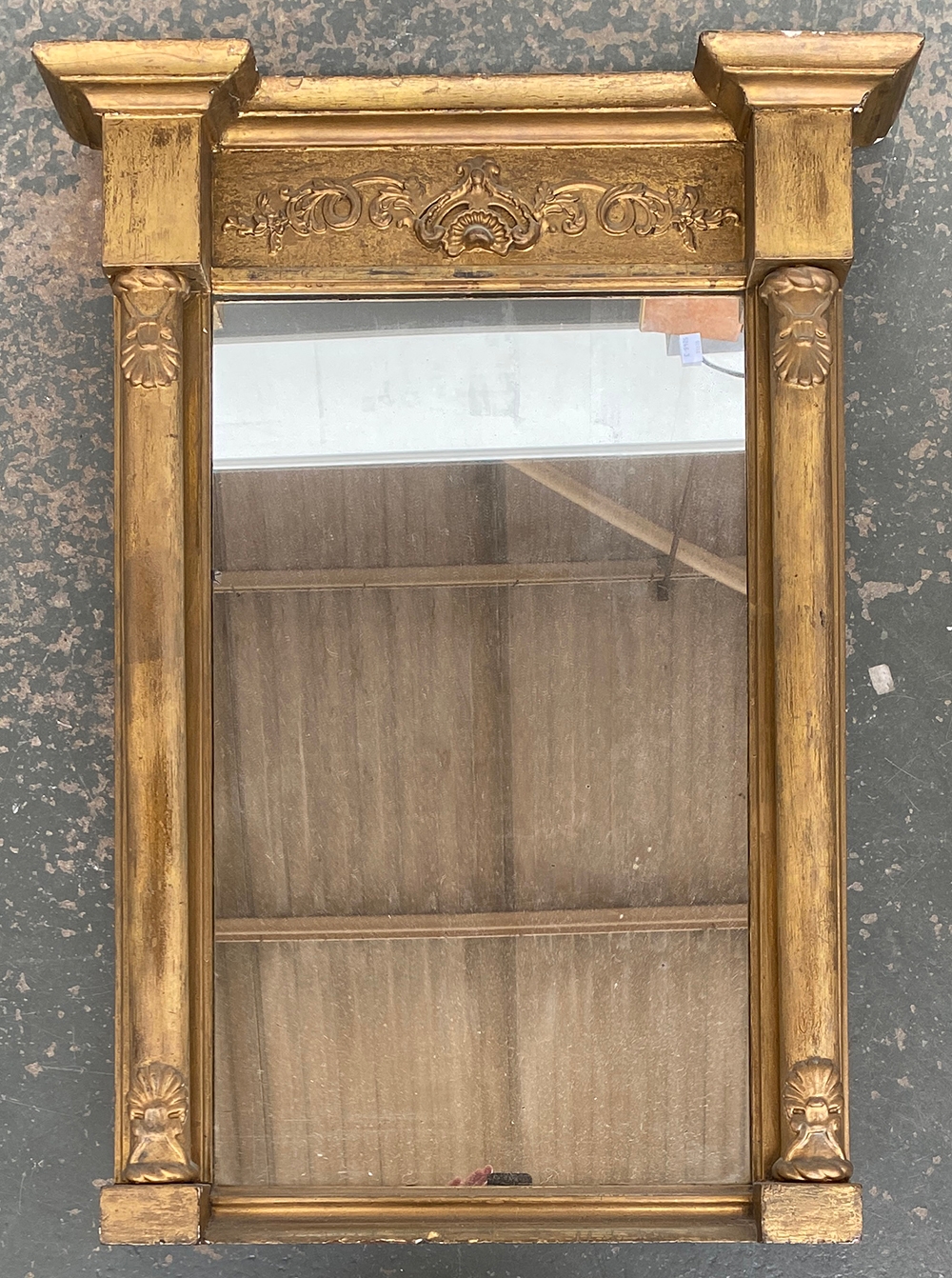 A Regency gilt gesso pier mirror with invert break pediment, 92x68cm