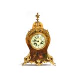 A French giltwood and ormolu mantel clock, in the manner of Vernis Martin, of bombe form, the enamel