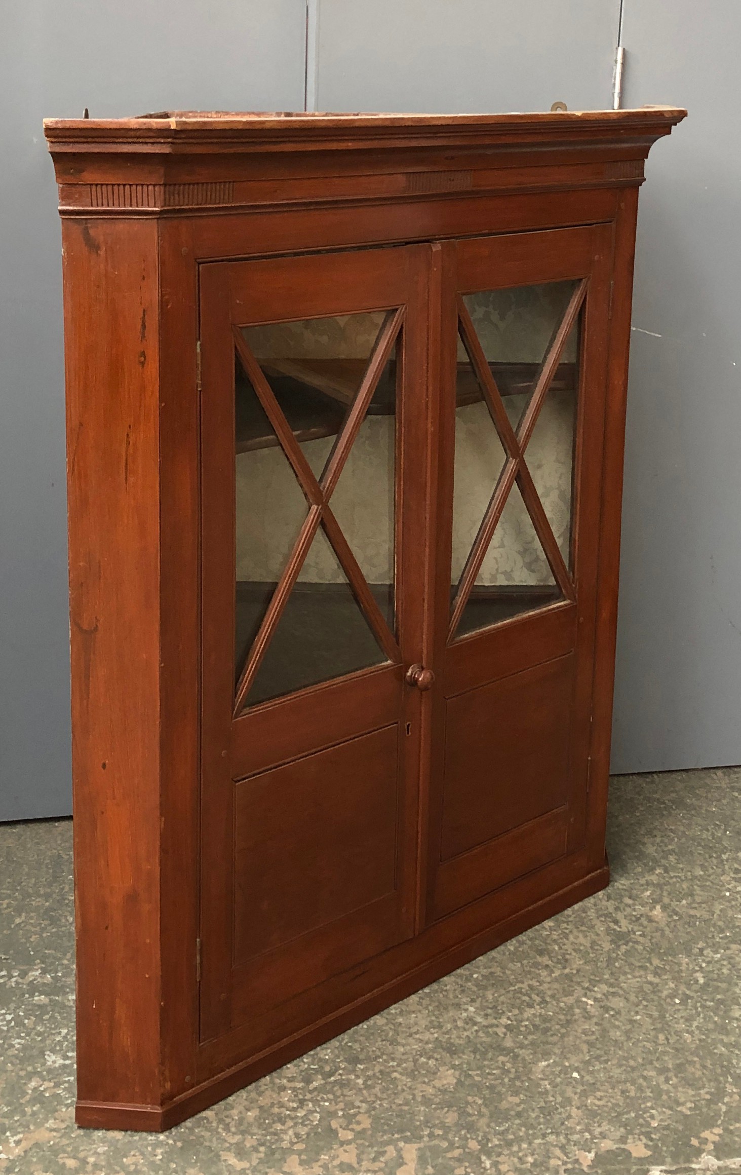 A glazed mahogany corner cupboard, 92cmW