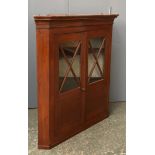A glazed mahogany corner cupboard, 92cmW