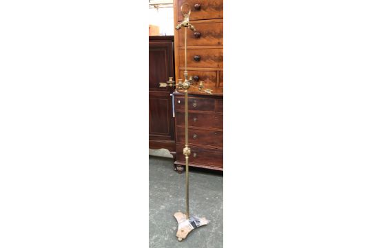 A brass two fitting standard lamp, with four candle sconces on arrow shaped supports, 184cmH