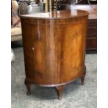 A bowfront mahogany cabinet, 97cmW