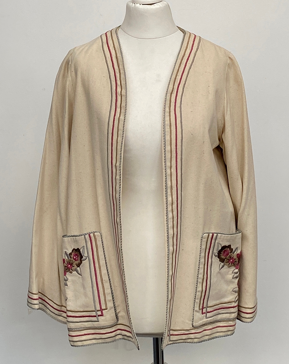 A vintage Janice Wainright linen jacket with embroidered trim and pocket detail, bears label 'by