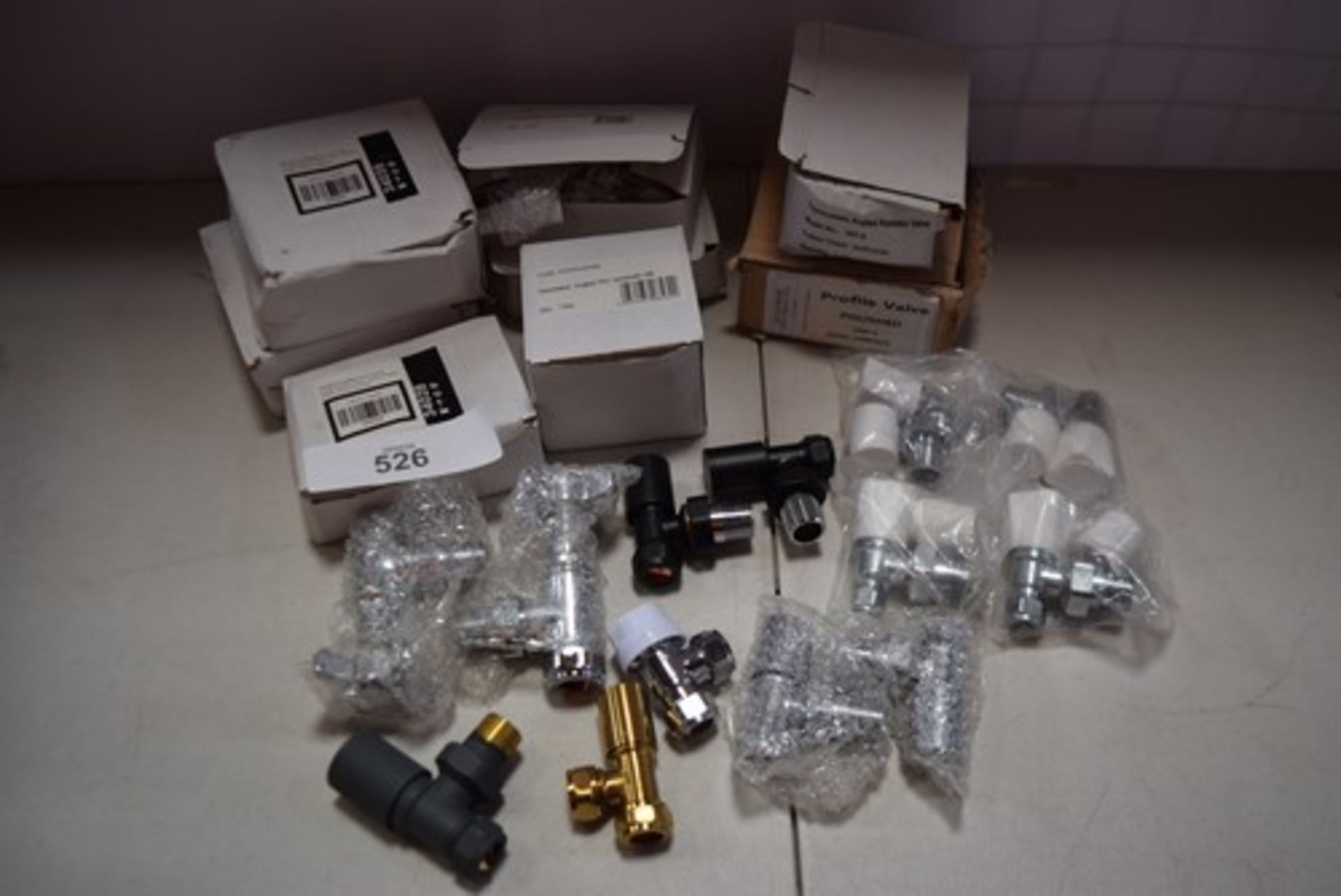 A selection of radiator valves and fixings, including Myson TRV2, Evolve angled radiator valves,