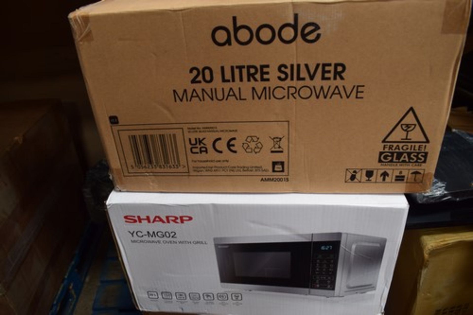 1 x Sharp microwave oven with grill, Model YC-MG02 and 1 x Abode 20 litre silver microwave - New