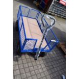 1 x blue 4 wheeled market trolley, mesh drop down sides, 60mm(W) x 1.26m(L), minor damage - rear
