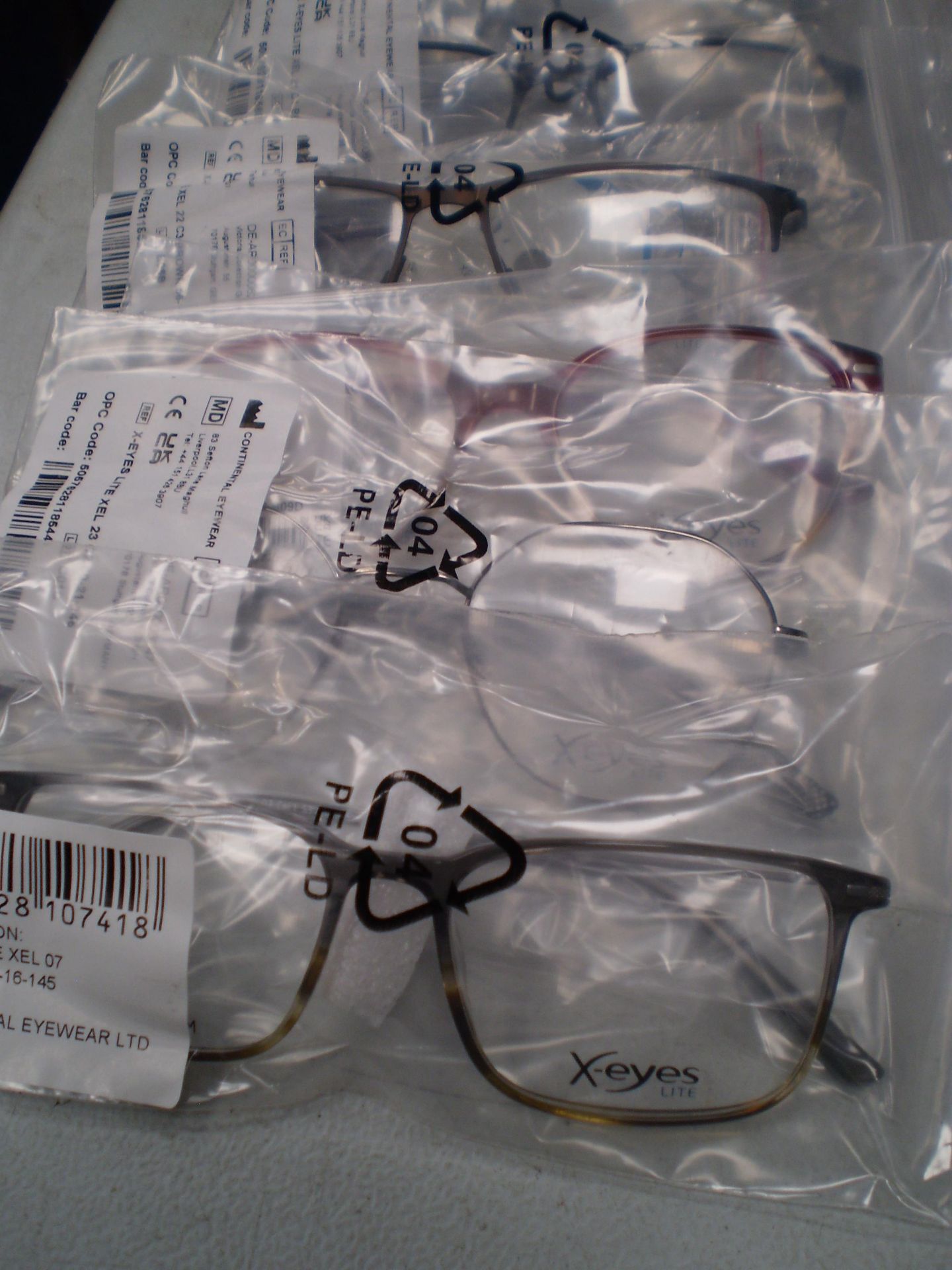 6 x pairs of X-eyes lite spectacle frames and 6 x X-eyes glass cases - sealed new in pack (C13A)