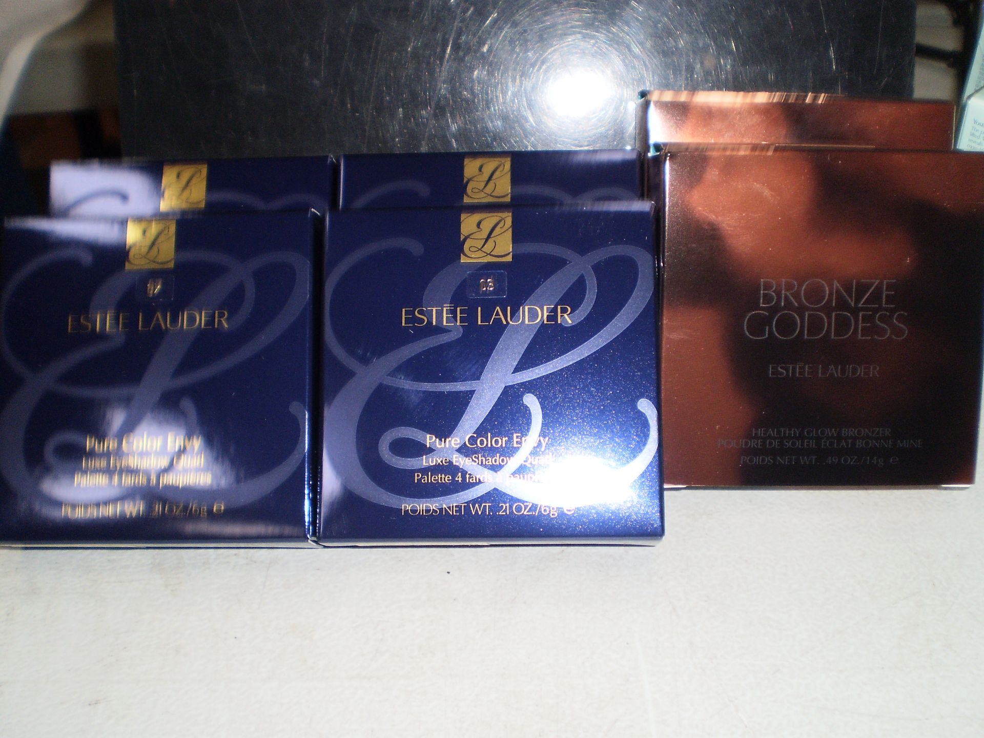 6 x items of Estee Lauder comprising 4 x eye shadow quad palettes, shade 2, 3 & 7, and 2 x bronze