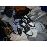 A magnum of second-hand clothing, various brands, including a Burberry hooded top, Pull & Bear