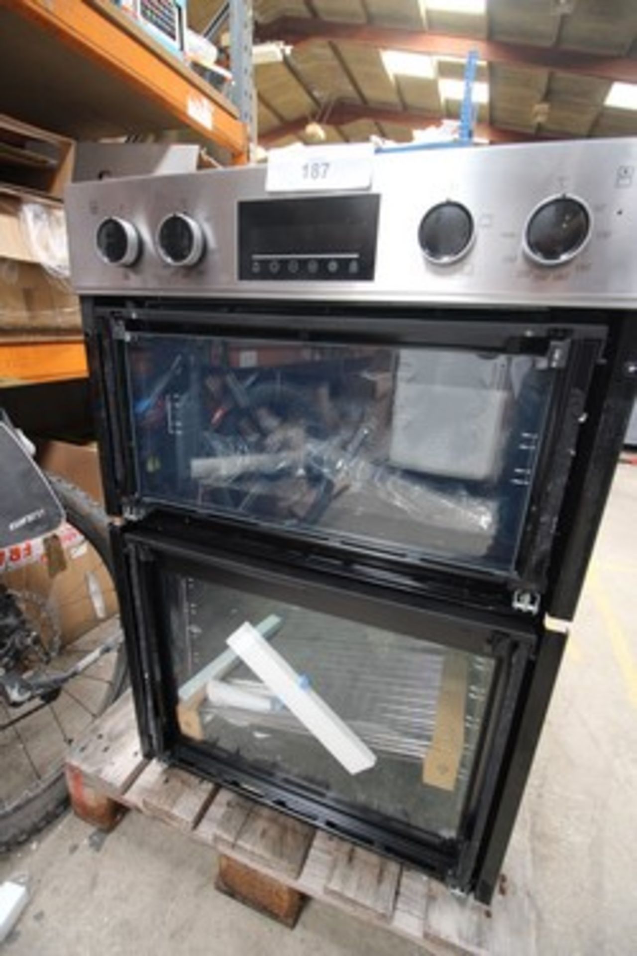 1 x Beko built in double oven, Model CDFY22309X, broken glass on both doors and small dent to top