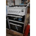 1 x Beko gas double oven and hob, Model EDG507W, dented top panel (RHS), paint scratches on sides