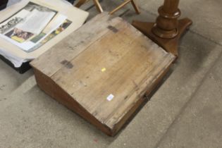 A stripped pine sloping desk top