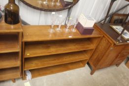 A teak open fronted bookcase